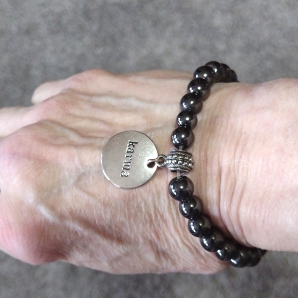 HEMATITE BEADED SILVER-TONE KARMA CHARM STRETCH BRACELET - Picture 1 of 9